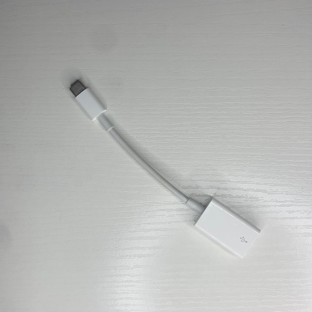white MacBook adapter